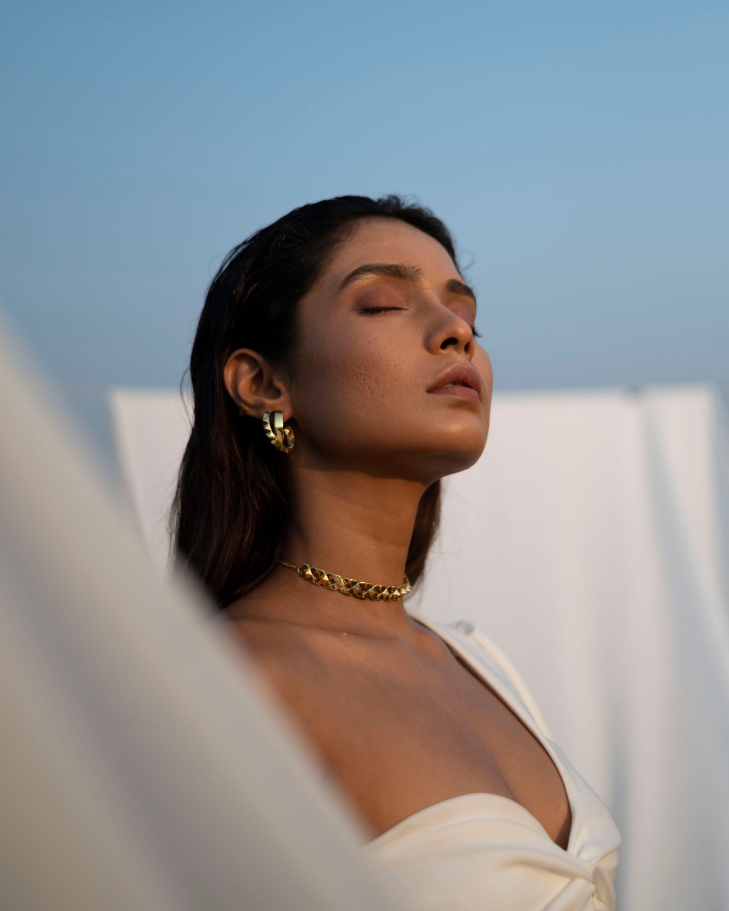 Modern and elegant gold sun burst earrings and choker for women