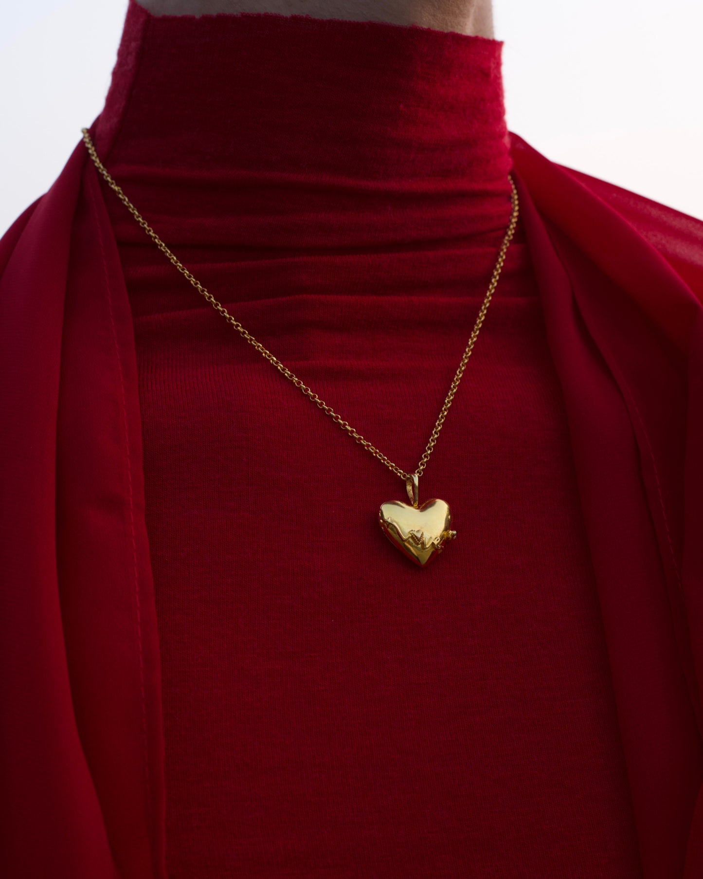 Contemporary heart shaped gold memory pendant