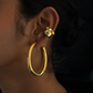 Unique hoop earring combo with earcuffs for a balanced sophisticated look.